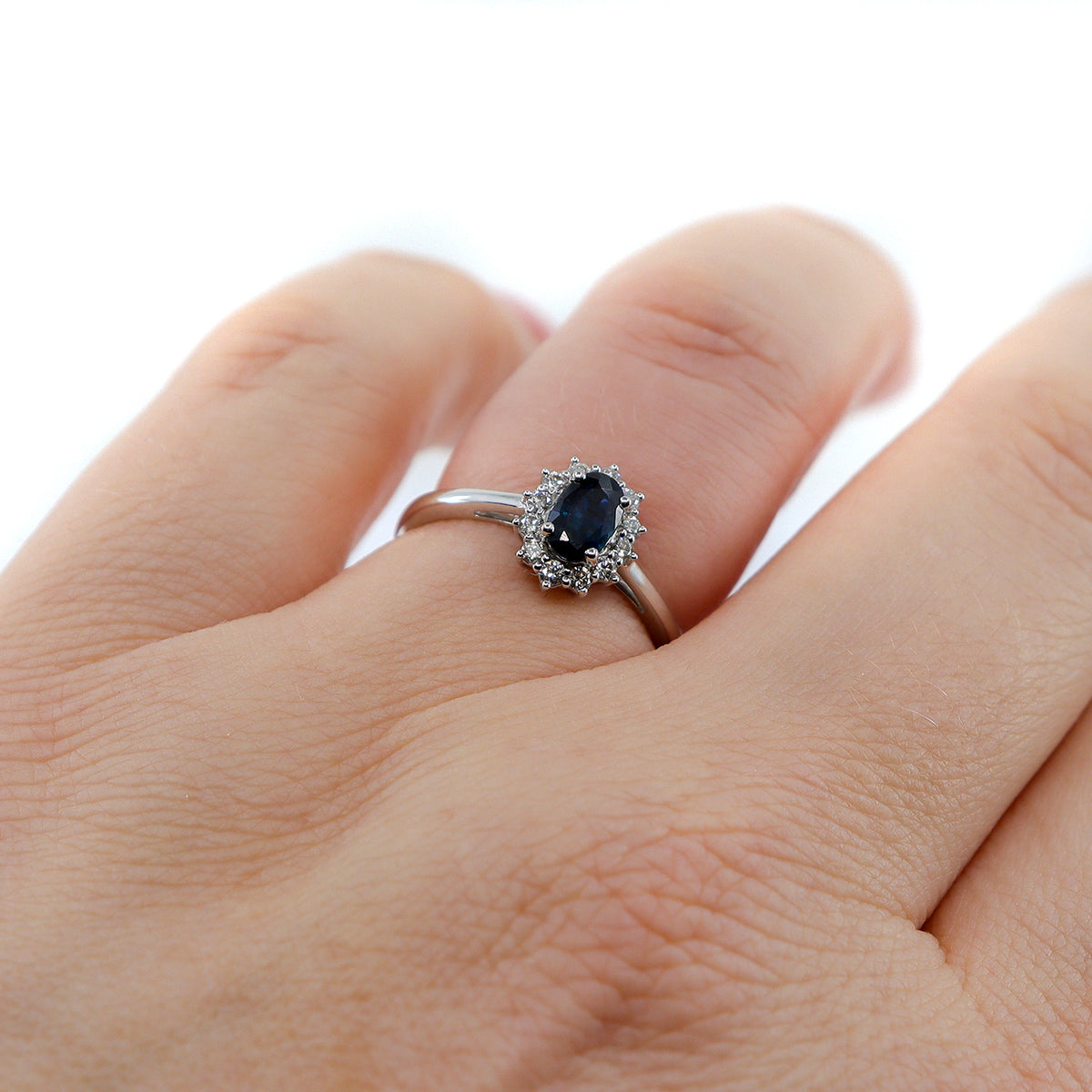 18ct White Gold Sapphire & 0.17ct Diamond Halo Ring